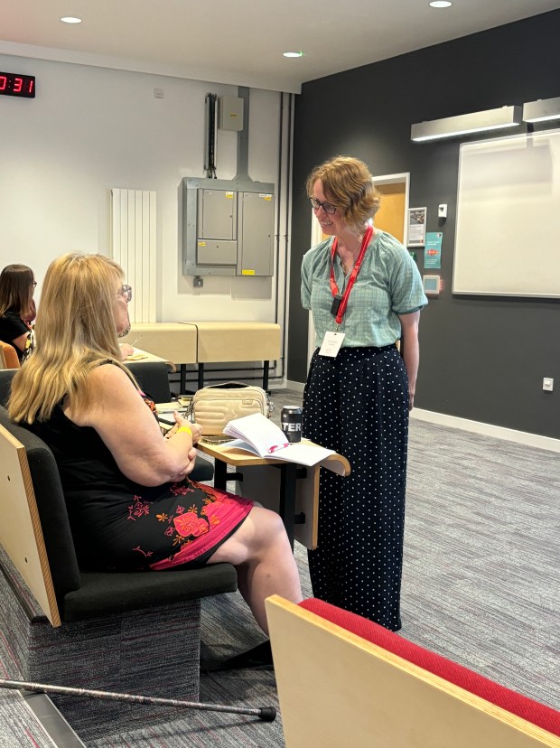 Talking to a student during a workshop presentation